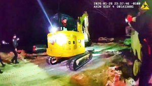 Police bodycam footage shows a bulldozer police chase ending after officers arrest a suspect with felony warrants.