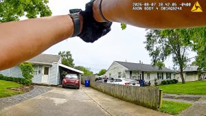 Armed man points two guns at police video