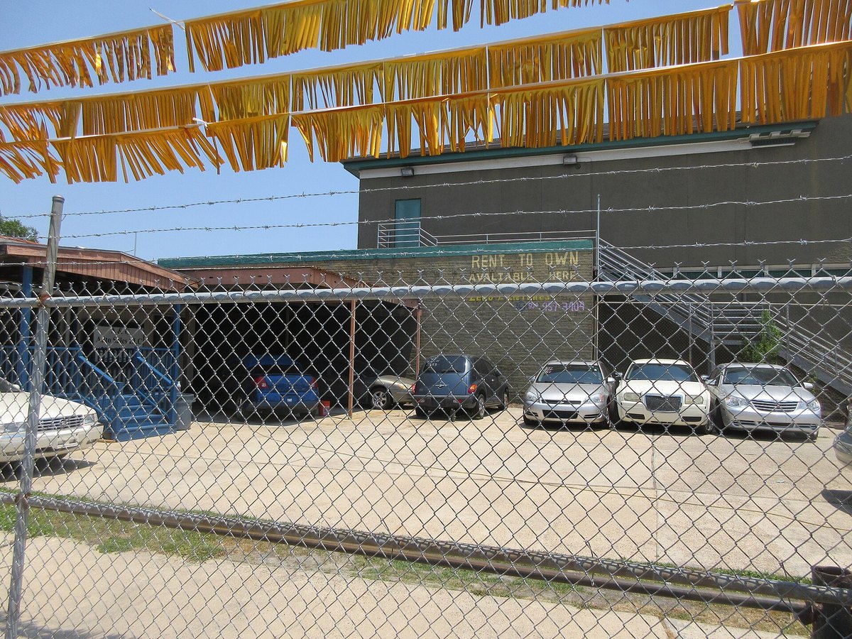 Used car dealership sales lot illustrating vehicle financing options